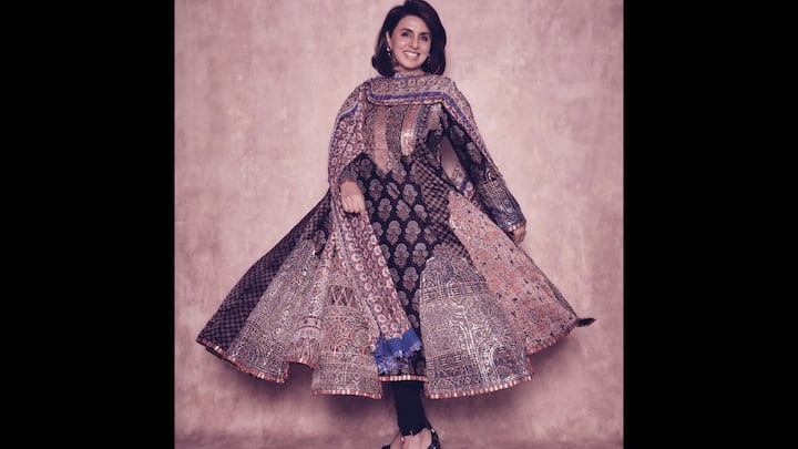 2. Patchwork Anarkali: Neetu Kapoor dazzled in ethnic elegance with this stunning patchwork Anarkali. The outfit blended tradition with high fashion. Rich in detail and radiating charm, the long traditional wear featured intricate block prints, metallic accents, and vibrant hues. The voluminous flare, paired with a matching dupatta, made this outfit perfect for festive occasions. From floral motifs to geometric detailing, every panel gave a contrasting touch. Neetu completed her look with minimal earrings and a ring to add richness. (Image Source: Instagram/@neetu54)