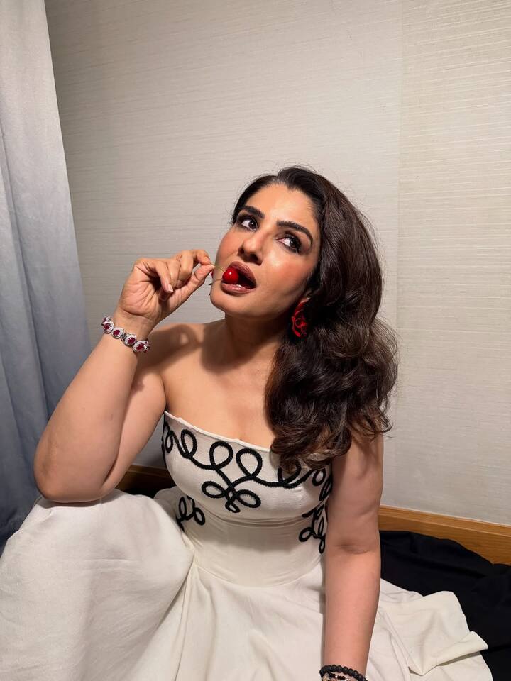 Raveena’s wrist dazzles with a mix of delicate bracelets, infusing a playful, personal touch that complements the gown’s structured elegance.