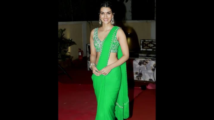 8. Sleek Vibrant Green Saree: Kriti Sanon wore a neon green saree that she paired with a heavily embroidered sleeveless blouse. The clean drape allowed the rich blouse to shine through, while the subtle fringe detailing on the pallu added a playful movement. The actress accessorised her fit with chunky bangle, statement jhumkas, and a ring that beautifullu complemented her traditional look. Kriti delivered a youthful and striking look in this outfit. Ideal for fashion-forward women looking to make a stylish statement this Teej, this outfit blends traditional colour symbolism with a bold contemporary cut. (Image Source: Pinterest/priyabublic4536)