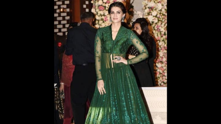 7. Contemporary Anarkali Look: If you’re looking for something regal yet contemporary for Hariyali Teej 2025, Kriti Sanon’s dark green sheer Anarkali gown is the perfect pick. The full-sleeve net outfit featured intricate floral embroidery from top to hem, creating a delicate yet powerful festive statement. The fitted bodice offered a structured silhouette, while the flared bottoms added grace. With her hair tied back in a sleek bun and a statement ring, the outfit oozed sophistication. This ensemble is a fabulous choice for an evening Teej function. (Image Source: Pinterest/sunetrasinbox7491)