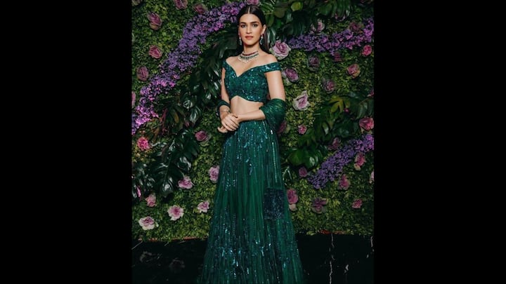 2. ⁠Emerald Sequin Lehenga: If you want to add shimmer to your festive wardrobe, Kriti Sanin’s dazzling emerald green Lehenga is the inspiration you’ve been waiting for. Perfect for the vibrant spirit of Hariyali Teej 2025, this sequin-drenched outfit blends glam and tradition with effortless ease. She wore a structured blouse with off shoulder detailing that added a modern edge. Paired with a matching dupatta, bold jhumkas, and a choker necklace, Kriti balanced the bling with classic elegance. This look is a masterclass in contemporary ethnic dressing with festive flair. (Image Source: Pinterest/sritamarimi)