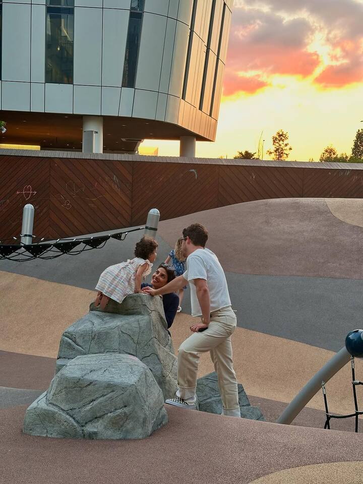 Another candid picture showed the couple playing with Malti at a children’s play area.