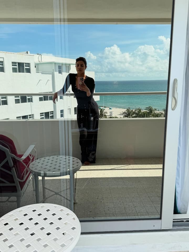 A soft-lit image of her by a window sipping a drink reflected her unwinding mood.