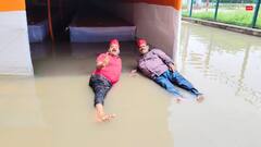 भारी बारिश के बाद कांवड़ शिविर में भर गया पानी, वाराणसी में पानी में ही लेट गए सपा कार्यकर्ता