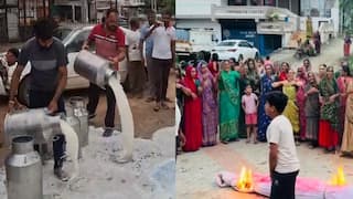 Photos: સાબર ડેરીની મનમાની સામે પશુપાલકોએ ટેન્કરો-કેનો ભરીને દૂધ રસ્તા પર ઢોળ્યું, મહિલાઓએ છાજિયા લીધા