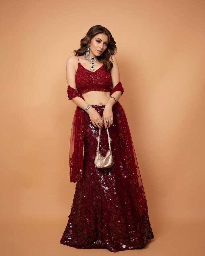 This lehenga with a shimry shining of all dark red color is quite trendy. Girls can also copy this outfit for a wedding or function.
