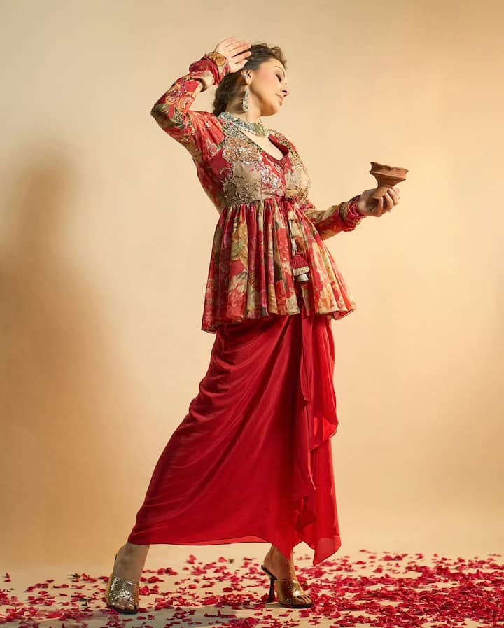 This multicolor's kurti and red color bottom dhoti's stylish outfit is very good. Girls can be inspired by this outfit for a function.