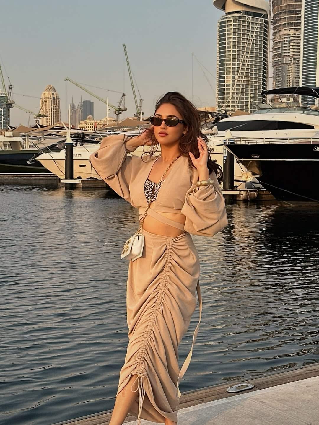 Crystal looks very glamorous and stunning in a beige color outfit. The actress has completed her look with open hair and goglus.