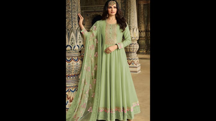 1. Prachi Desai: Prachi Desai looked ethereal in her flowing pastel green Anarkali suit. The floor-length silhouette adorned with delicate thread embroidery is the ideal fit for Hariyali Amavasya 2025. The outfit’s charm lies in its subtlety—neither too loud nor too minimal, striking the right balance for festive grace. The actress paired her ethnic attire with a sheer dupatta, scattered with floral motifs that complemented her ensemble. The bold matha patti elevated her traditional look while embracing tradition with sophistication. (Image Source: Twitter/@ClothingEmpress)