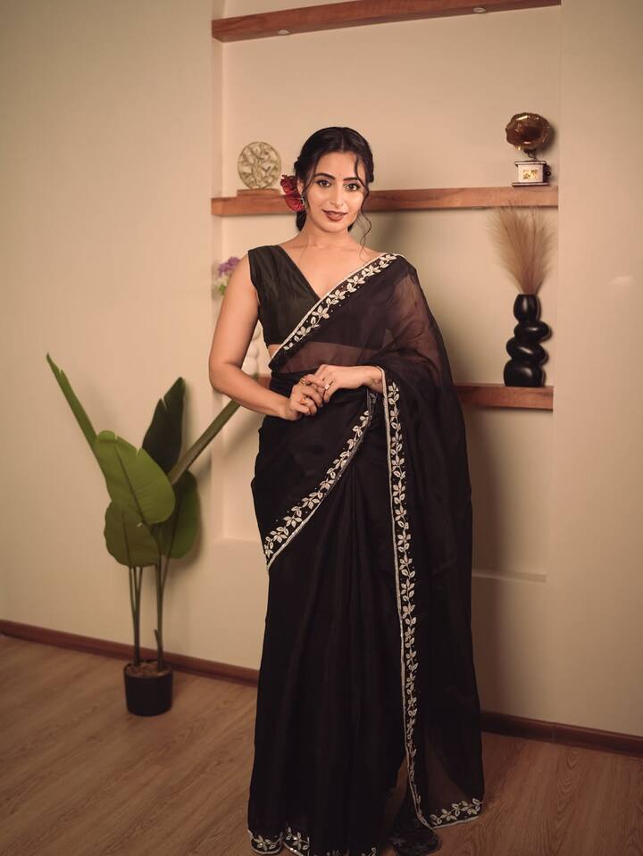 A fine white embroidered border adds a subtle contrast and a hint of detail.