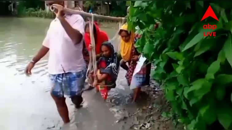 Hingalganj Bad Road: ফের খারাপ রাস্তায় রোগীর দুর্ভোগ, হাসপাতালে নিয়ে যেতে ভরসা দোলনা North 24 Parganas Hingalganj Bad Road Patients suffer again Hingalganj Bad Road: ফের খারাপ রাস্তায় রোগীর দুর্ভোগ, হাসপাতালে নিয়ে যেতে ভরসা দোলনা