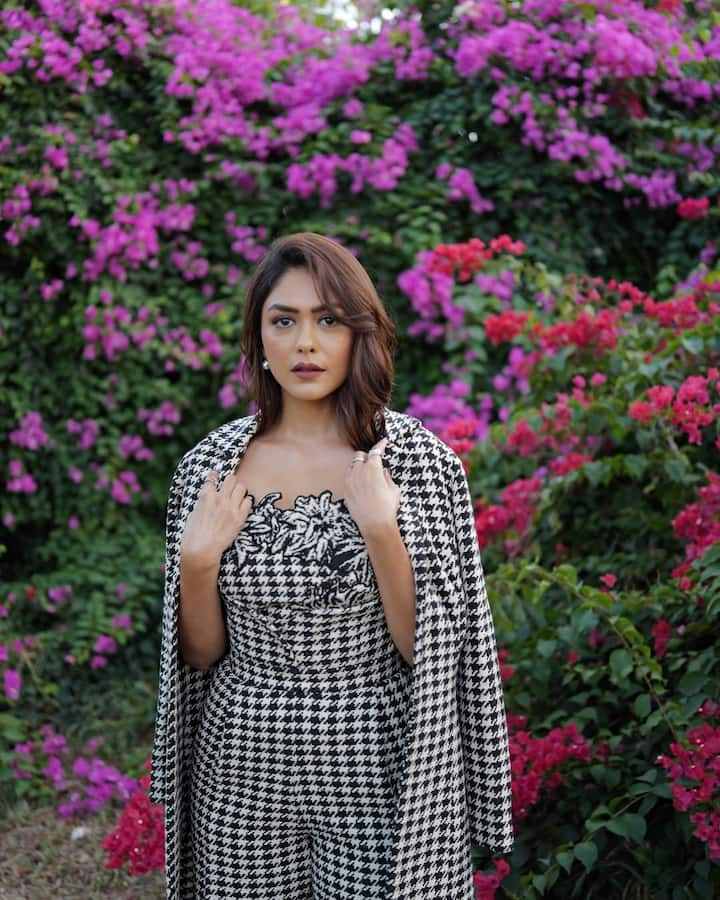 She topped her look with a matching trench coat, making a case for power-dressing. (Instagram/@mrunalthakur)