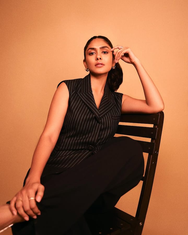 Striped pantsuit: Mrunal Thakur looked as ravishing as ever in a striped black pantsuit, and paired it up with attractive silver stilettos.