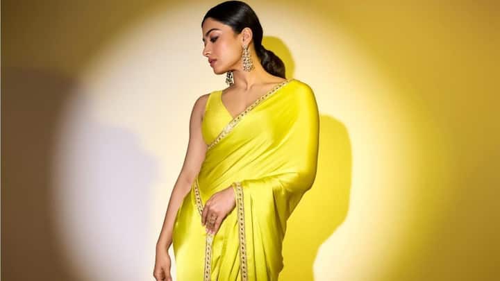 Rashmika's sunflower yellow satin saree brings a splash of sunny cheerfulness. Its bright colour is just perfect for infusing your Raksha Bandhan outfit with a dose of vibrancy. (Image Source: Instagram/ rashmika_mandanna)