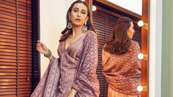 Karisma styled this mauve silk kurta with gold embroidery. She paired it with a matching salwar and an elaborate dupatta, accessorising with gold-toned jewellery for a celebratory look. (Image Source: Instagram/ stylebyami)