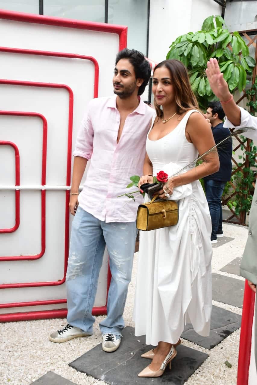 At the same time, the actress's son is wearing a pink shade shirt with blue jeans. Arhan is also very dashing in this look.