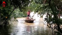রাস্তার উপর দিয়ে বইছে নদী ! যাতায়াতের একমাত্র ভরসা নৌকা, নদীবাঁধে অসংখ্য ফাটল, আতঙ্কে স্থানীয়রা