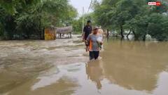 मिर्जापुर के हरसिंहपुर गांव में बाढ़ की मार, लोग घर छोड़ने को मजबूर, बहाव में ड्यूटी पर जाने की मजबूरी
