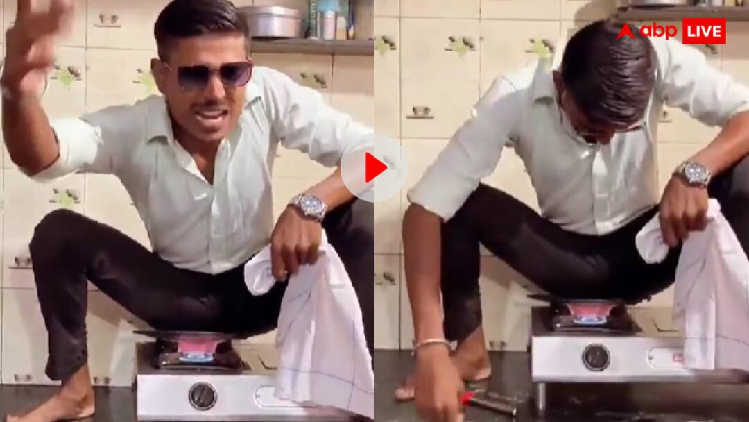 Man started making reels by sitting on a burning pan video goes viral भाई तू थोड़ा सा सनकी है क्या? गैस जलाकर गर्म तवे पर बैठ गया शख्स...यूजर्स बोले देश चुनौतियों से नहीं...वीडियो वायरल