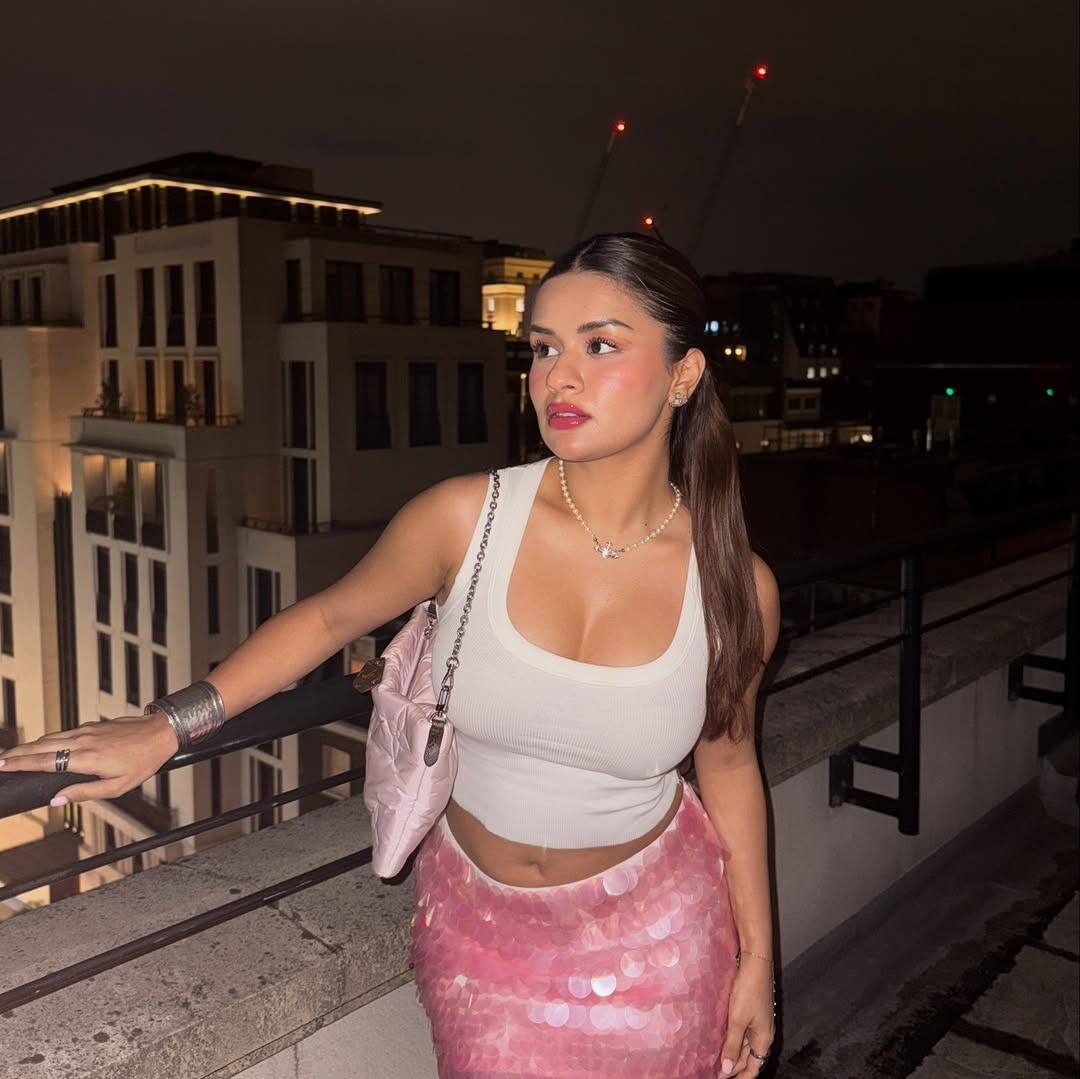 Avneet Kaur has paired a white crop top with her pink mini skirt. This color combination is very much on the actress.