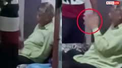 Video: बाल पकड़ पिता को मारे कई थप्पड़, बेटे के सामने हाथ जोड़ता नज़र आया शख्स, पड़ोसियों ने बनाया वीडियो