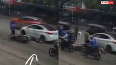 Video: आप ही बताइए गलती किसकी? स्कूटी से गिरा शख्स, ऊपर चढ़ गई कार, हादसे का वीडियो वायरल