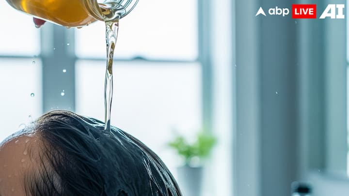 5. Apple Cider Vinegar Wash Apple cider vinegar restores the scalp's natural pH, making it hard for dandruff-causing fungus to thrive. Mix equal parts of apple cider vinegar and water, and use it as a final shine to your hair. Its antibacterial properties also help in maintaining scalp health and controlling excess oil. (Image Source: ABPLIVE AI)