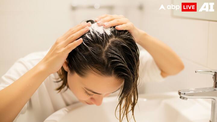 4. Baking Soda Scrub: Baking soda acts as a natural exfoliant and removes the dead skin cells. It also helps in reducing the fungal growth naturally. Wet your hair and gently rub a small amount of baking soda into your scalp. Leave it on for a few minutes and rinse thoroughly. This will help unclog pores, remove flakes, and restore the scalp's balance. Using it once a week can keep dandruff under control. (Image Source: ABPLIVE AI)