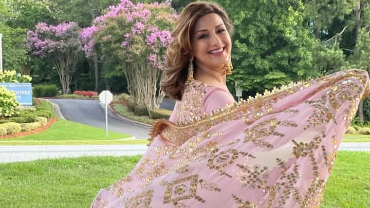 Sonali Bendre radiated grace in this pastel pink salwar kameez with gold zari work and a flared kurta. The look was completed with a heavy dupatta in silver and gold motifs, perfect for festive elegance. (Image Source: Instagram/ iamsonalibendre)