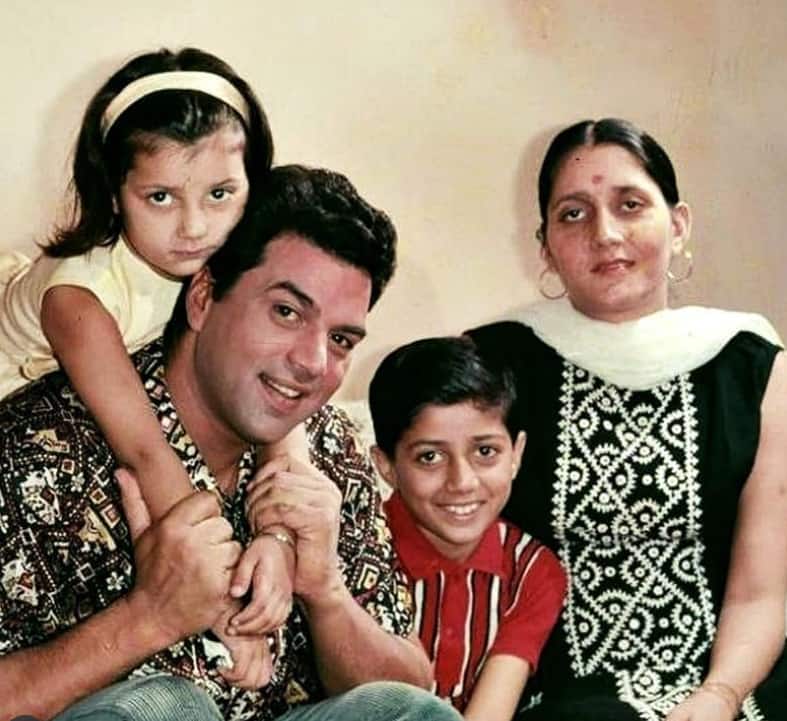 In this rare photo, Prakash can be seen in a black suit. Put a dot on the forehead and the light wearing hops earrings looks gorgeous.