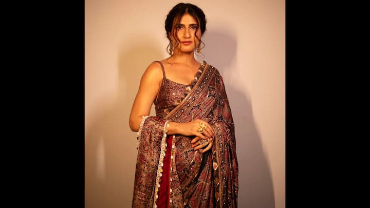 2. Fatima Sana Shaikh: Fatima Sana Shaikh turned showstopper in a mesmerising Ajrakh block-printed saree. The handcrafted drape, detailed with earthy maroon, black, and sand tones, was elevated with delicate sequin work, giving the traditional textile a glamorous twist. Styled with a strappy blouse, statement rings, and bold earrings, Fatima’s look exuded boho-chic elegance while staying rooted in Indian craft traditions. (Image Source: Instagram/@labelnityabajaj)