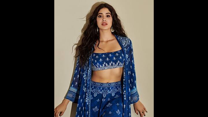 4. Janhvi Kapoor: Janhvi Kapoor wore a chic indigo blue block print co-ord set and served a striking look. The breezy outfit featured a strappy crop top paired with high-waist flared trousers, both adorned with delicate floral block motifs. She paired her look with a matching shrug that enhanced its effortless vibe. Styled with statement silver jhumkas and minimal makeup, Janhvi’s look balanced traditional craft with Gen-Z coolness. (Image Source: Instagram/@janhvikapoor)