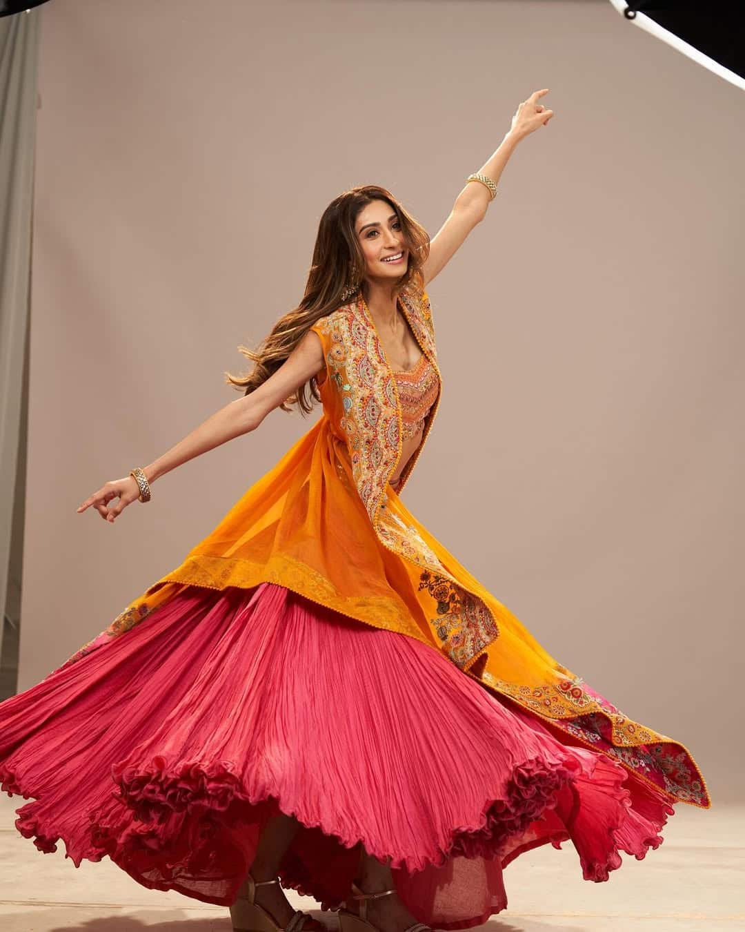 Paloma looks gorgeous wearing a matching shrug and red lehenga with this Yellow Bralet. His look is giving festive vibes.