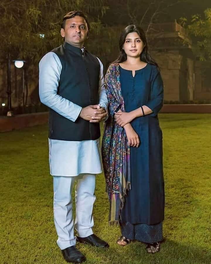 Along with the saree, Akhilesh Yadav's wife does not look less than a nymph. She looks quite classy, carrying printed scarf with a plane suit.