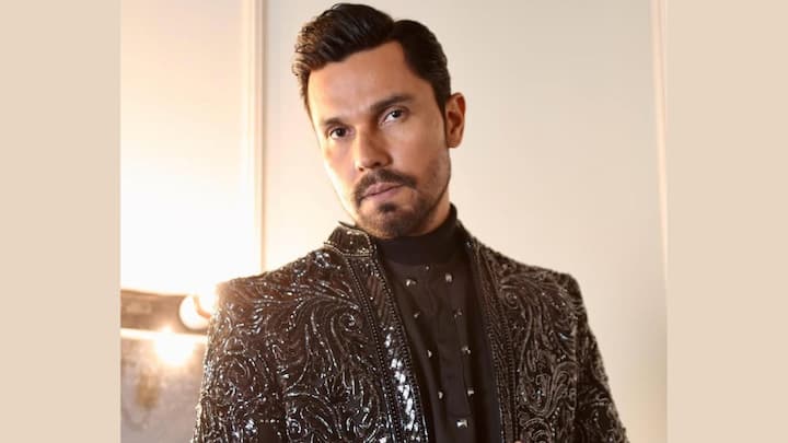 Indo-Western Edge: A black asymmetrical coat with an Indian silhouette showcased his ability to fuse cultural heritage with global style. Randeep knows how to make fusion fashion look effortlessly cool. (Image Source: Special Arrangement)