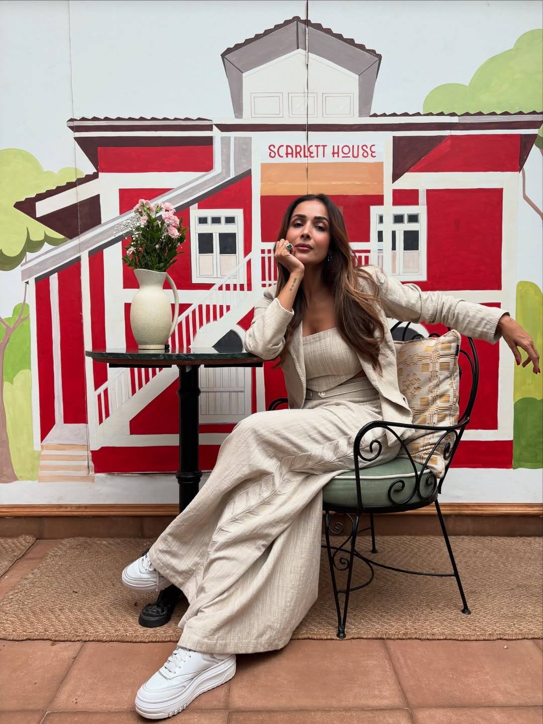 In this last look, Malaika is wearing a co-ord set of beige color. Blazer with long flared pants and matching tops is giving them a very classy and comfortable vibe. White sneakers are giving casual and trendy touch to their outfits.