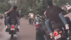 Video: पेट्रोल की टंकी पर बैठकर बॉयफ्रेंड से लिपटी नजर आई लड़की, रोमांस का वीडियो वायरल