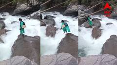 কর্তব্যে অবিচল! জরুরি টিকাকরণ, ফুঁসতে থাকা নদীর ওপর দিয়েই লাফ দিলেন নার্স, ভাইরাল হল ভিডিও