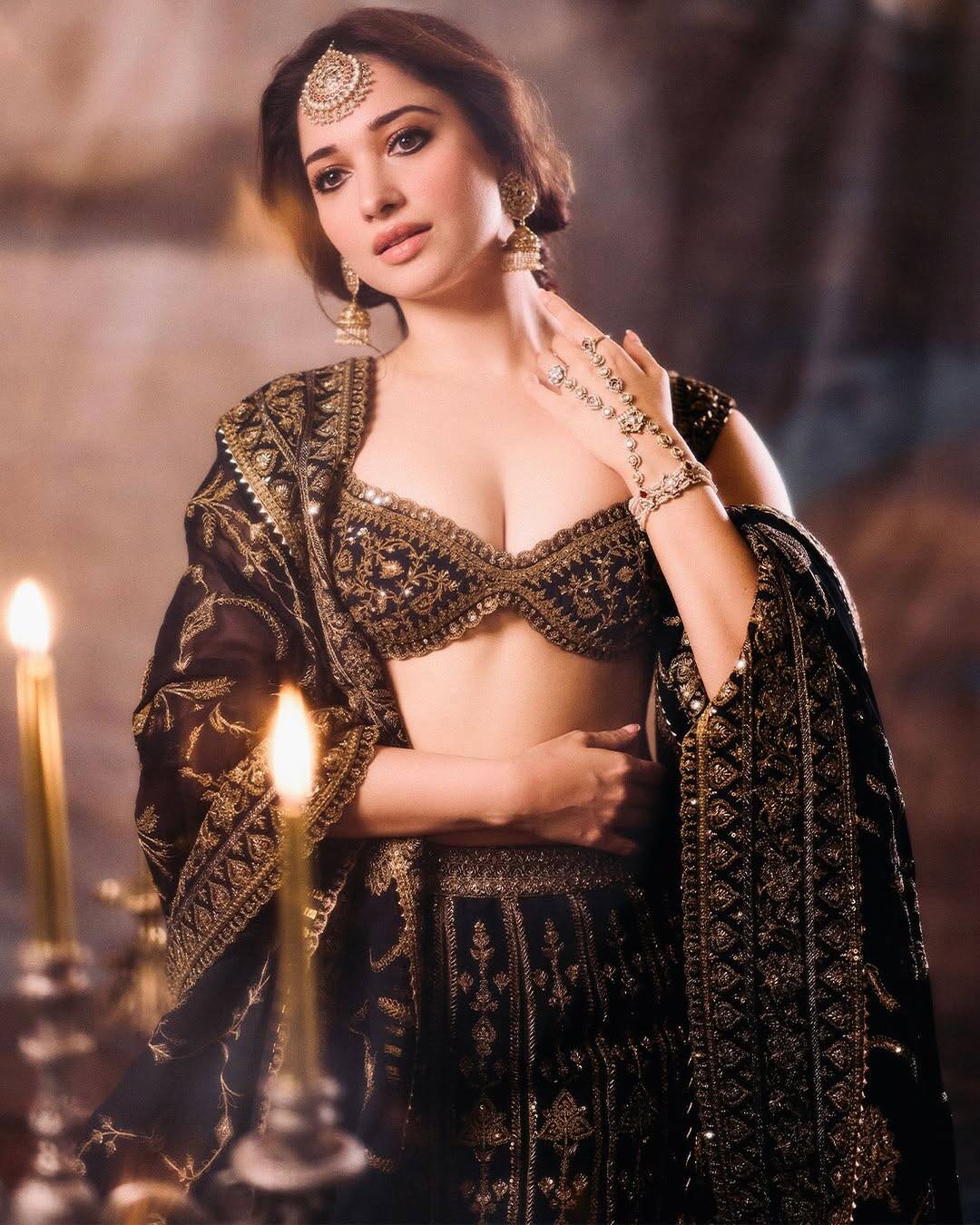 In this picture, the actress is wearing a lehenga choli with embroidery of black and golden combination. He has carried traditional jewelery with deep neck blouse and matching dupatta, making his open hair and light makeup making this royal look even more beautiful. This look looks quite rich and royal style.