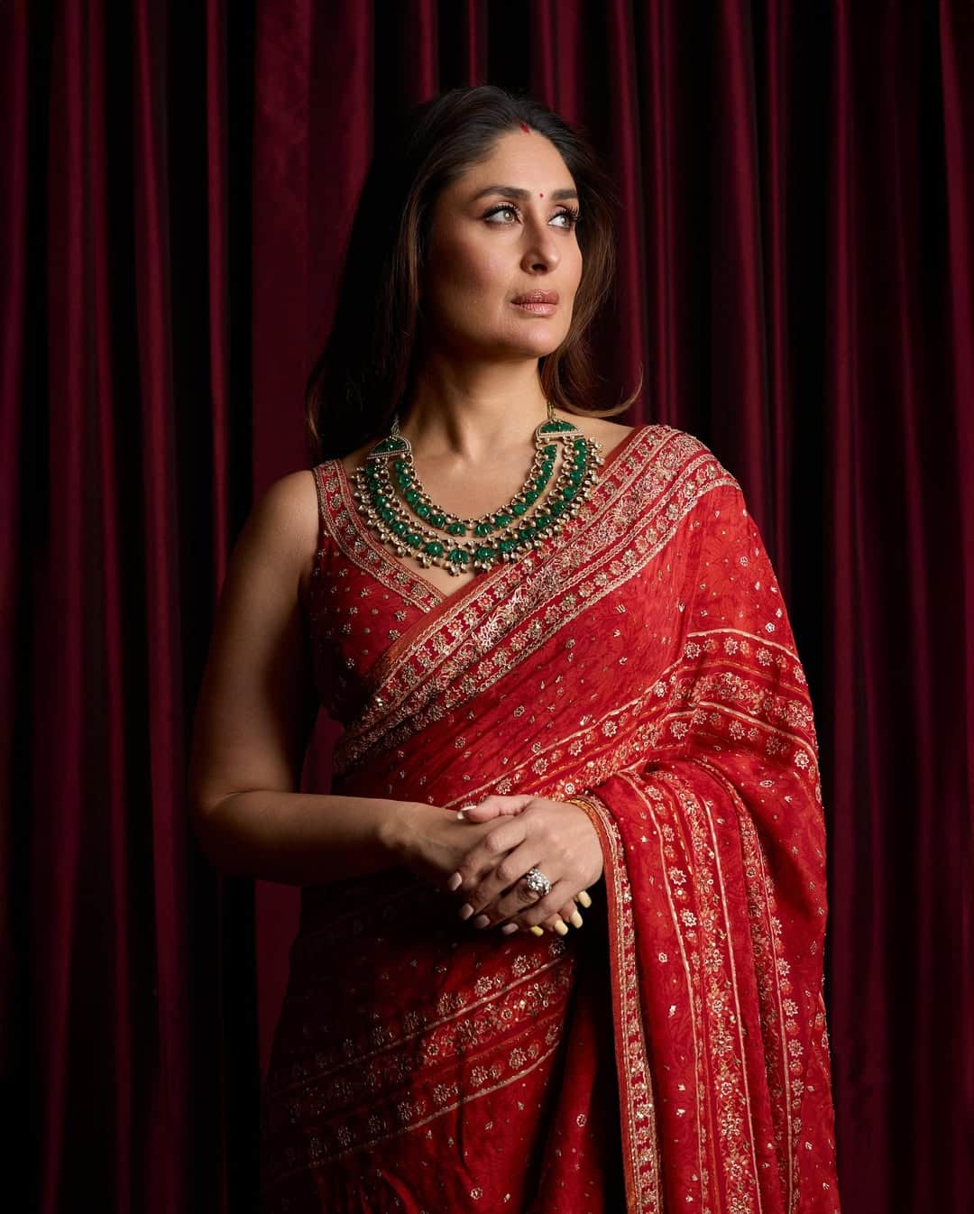 This glamorous traditional look of Kareena Kapoor in a red saree is the best choice for any festive event. Heavy work saree, necklace and open hair made her look even more graceful.