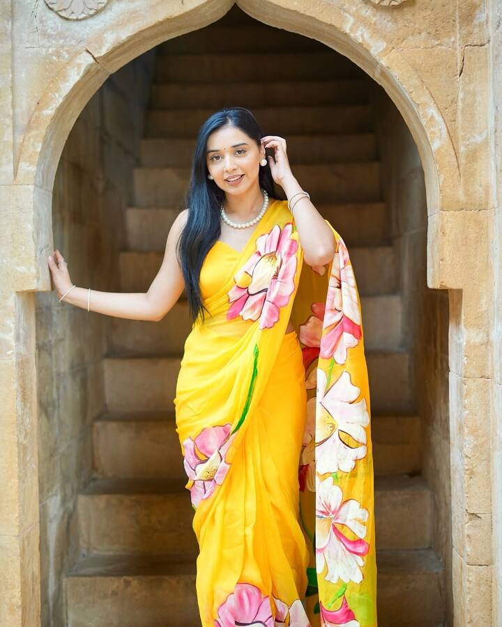 Tanya is looking very beautiful in this Yellow saree, she made this look attractive with simple jewelery and open hairstyle.