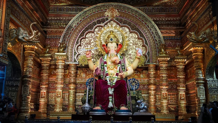 Lalbaugcha Raja 2025 unveiled in Mumbai, the iconic Ganesh idol dazzles in magenta attire as lakhs of devotees gear up for ten days of grand Ganesh Chaturthi celebrations.