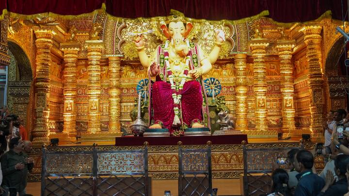 The first look of Lalbaugcha Raja 2025 has been revealed, with the idol radiating grace in striking magenta attire that left devotees in awe. (Image Source: PTI Images)