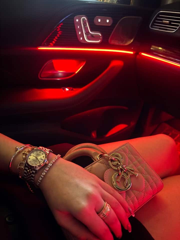 Along with his outfit, he also matched his accessories perfectly. With his stylish outfits, he paired the statement watch and bracelet. Along with this, the handbag of pastel color is being enhanced by his overall look.