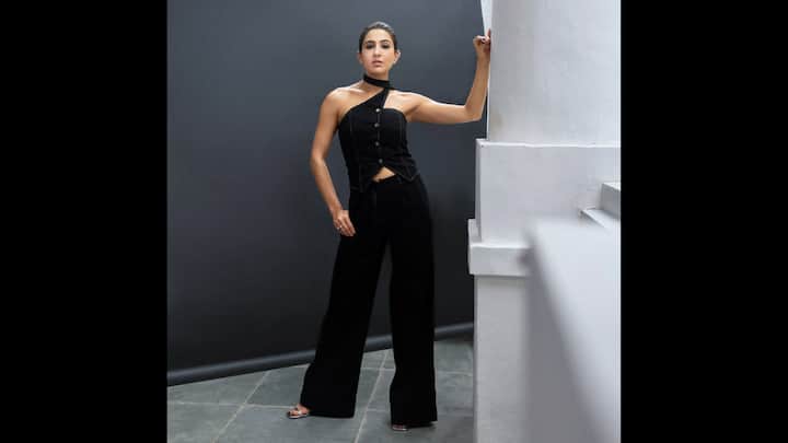 3. Sara Ali Khan: This simple yet sophisticated black co-ord set is a prime example of Sara Ali Khan’s signature everyday chic aesthetic. The outfit, a chic co-ord set, featured a relaxed-fit, denim top with an asymmetrical neckline, and wide-leg pants. This black co-ord set is a true wardrobe staple. It's the perfect uniform for those days when you want to look polished and stylish without sacrificing a single ounce of comfort. (Image Source: Instagram/@saraalikhan95)