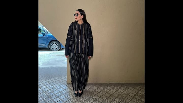 7. Karisma Kapoor: This black and white striped co-ord set is the ultimate blueprint for a look that's comfortable, stylish, and perfect for any day of the week. The ensemble consisted of a loose-fitting, full-sleeved button-down shirt and matching straight-cut pants, creating a relaxed yet polished silhouette. She finished the ensemble with a pair of stylish sunglasses and classic earrings. It’s the ultimate inspiration for anyone who wants to look effortlessly chic without trying too hard. (Image Source: Instagram/@therealkarismakapoor)