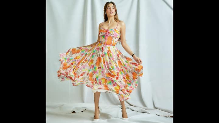 5. Janhvi Kapoor: Janhvi Kapoor can turn heads in a dramatic gown, it's her casual, everyday style that truly resonates with the Gen-Z crowd. This stunning floral dress is the perfect example of her fresh, modern aesthetic. To complete the airy, summer-ready vibe, Janhvi kept her styling clean and simple. She chose classic white heels and accessorised with minimal jewellery. This floral dress proves that you don't need a heavy, complicated outfit to look chic and stylish. (Image Source: Instagram/@janhvikapoor)