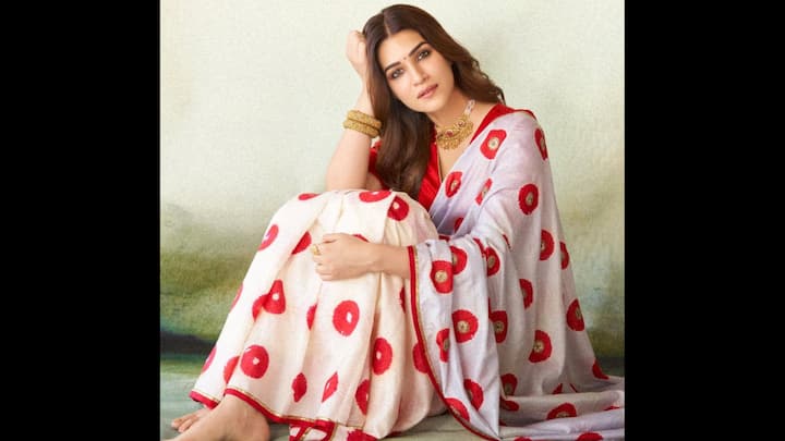 3. Kriti Sanon: Kriti Sanon brought fresh, youthful energy to the classic white saree with her striking printed drape. The saree featured bold red motifs scattered across a soft white base. She paired it with a contrasting red blouse that amplified the vibrancy of her look. To complete the look, she added statement jewellery including chunky bangles and a necklace balanced the outfit beautifully. (Image Source: Instagram/@kritisanon)