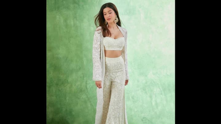 7. Shanaya Kapoor: Shanaya Kapoor brought fresh elegance to festive fashion with her ivory embroidered co-ord set. The outfit featured a structured bustier paired with wide-leg trousers, layered with a long embroidered jacket that added flow and sophistication. The subtle floral detailing on the fabric lent a traditional vibe, while the contemporary cut made it youthful and chic. Shanaya’s look is ideal for festive brunches, pre-wedding functions, or intimate celebrations. (Image Source: Pinterest/Rajesh79245)