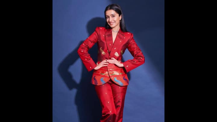 6. Shraddha Kapoor: Shraddha Kapoor gave festive dressing a chic twist with her striking red silk co-ord set. The structured blazer and straight-fit pants were elevated with traditional golden motifs and embroidered detailing. The glossy silk fabric added richness, while the deep red hue made it a perfect pick for festivities. This look is proof that co-ords can be both festive and sophisticated, making them a must-have in every fashion-forward wardrobe. (Image Source: Pinterest/Redmachine3105)